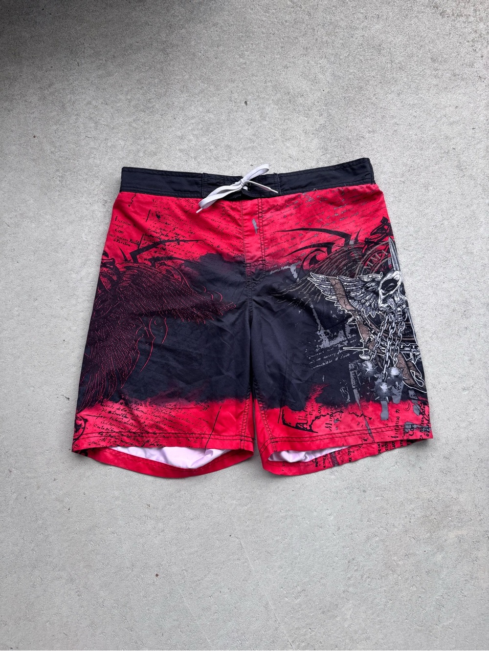 Men's Red and Black Athletic Swim Shorts with Graphic Skull Accent